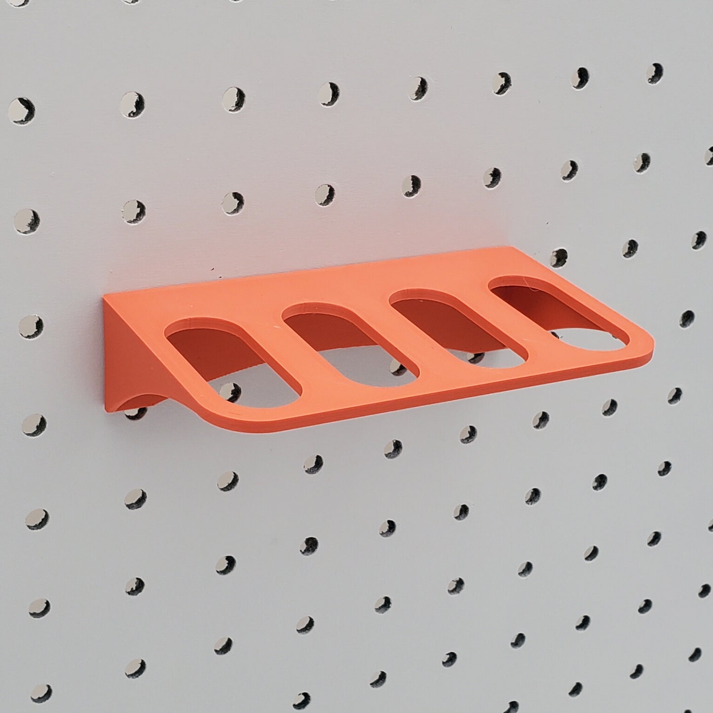Muted Red Scissor Holder for a pegboard.