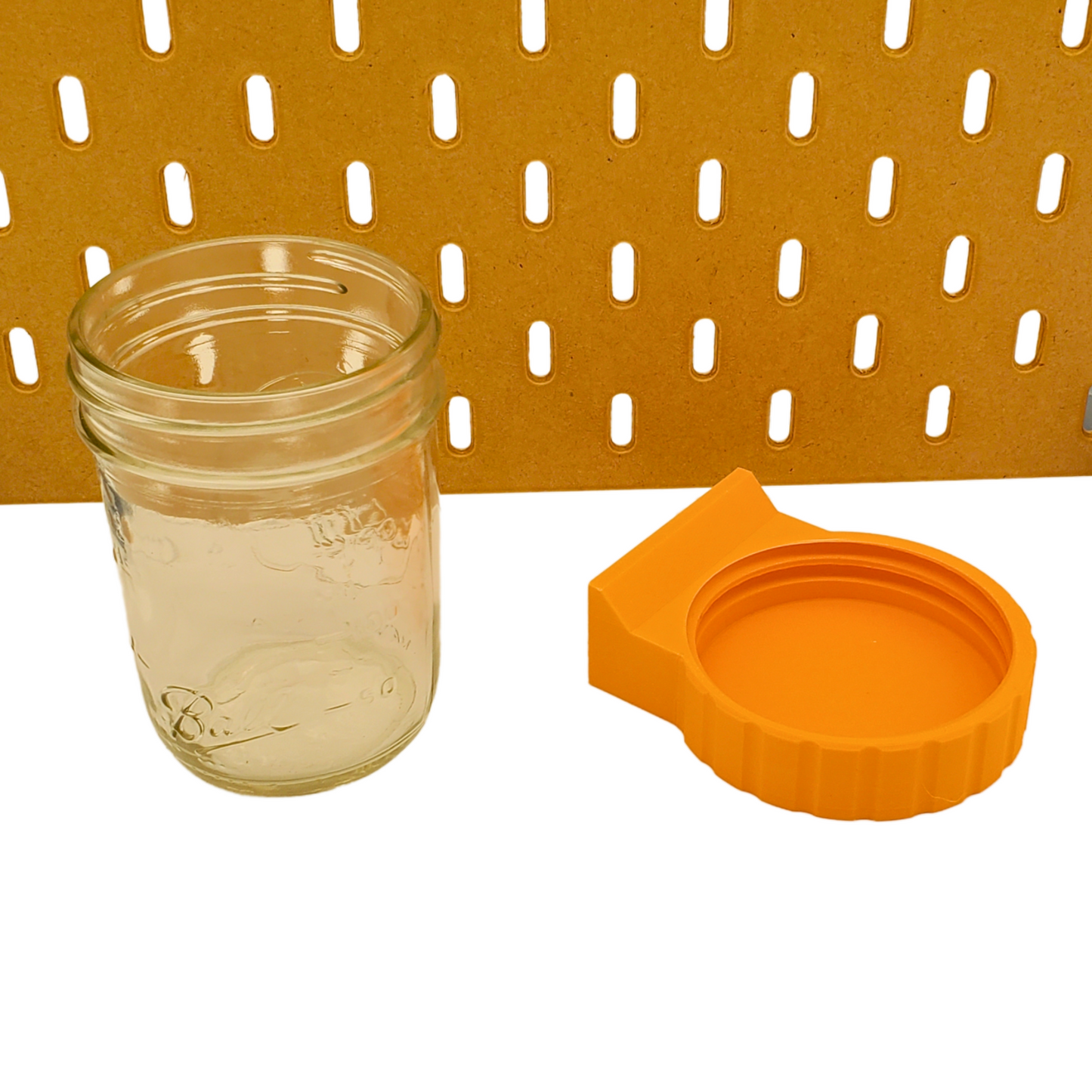 Bottom view of SKADIS Mason Jar adapter. Threads visible.