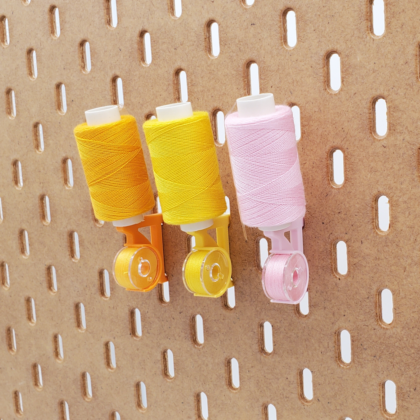 Savannah Yellow, Sunrise Orange, and Light Pink Straight thread/bobbin holders for SKADIS pegboard