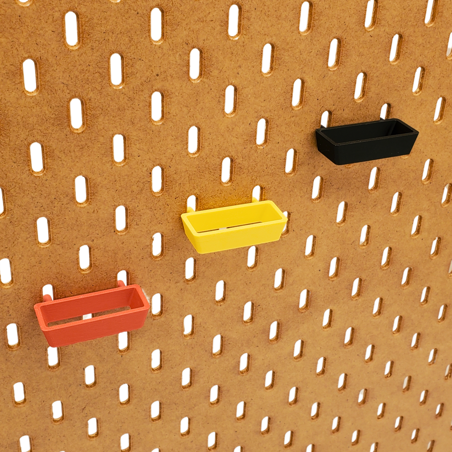 angle profile of Muted Red/Savannah Yellow/Charcoal Black SKADIS Plier/scissor storage.
