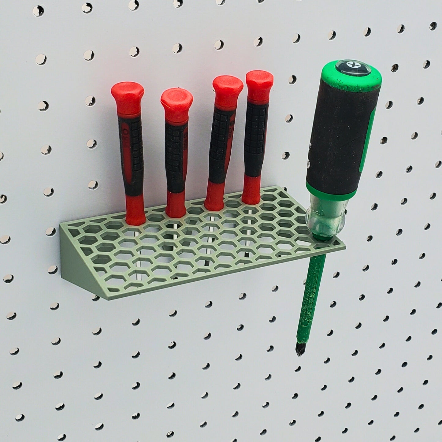 Muted Green screwdriver holder on pegboard