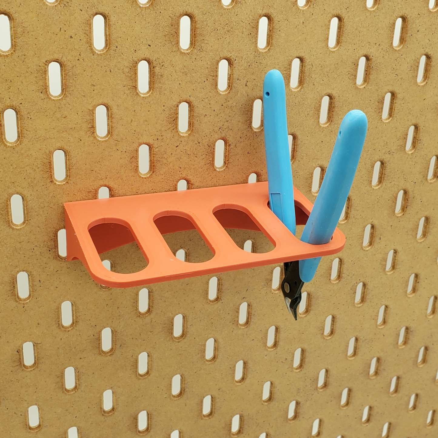 Muted Red 4 spot Plier storage, produced by Just Hanging. Compatible with IKEA SKADIS Pegboards.