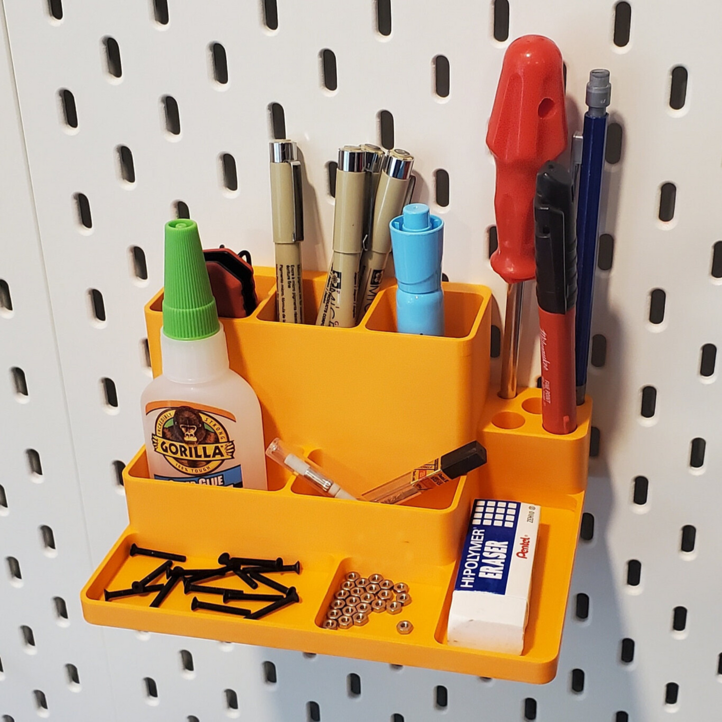 Desk organizer on a white skadis board