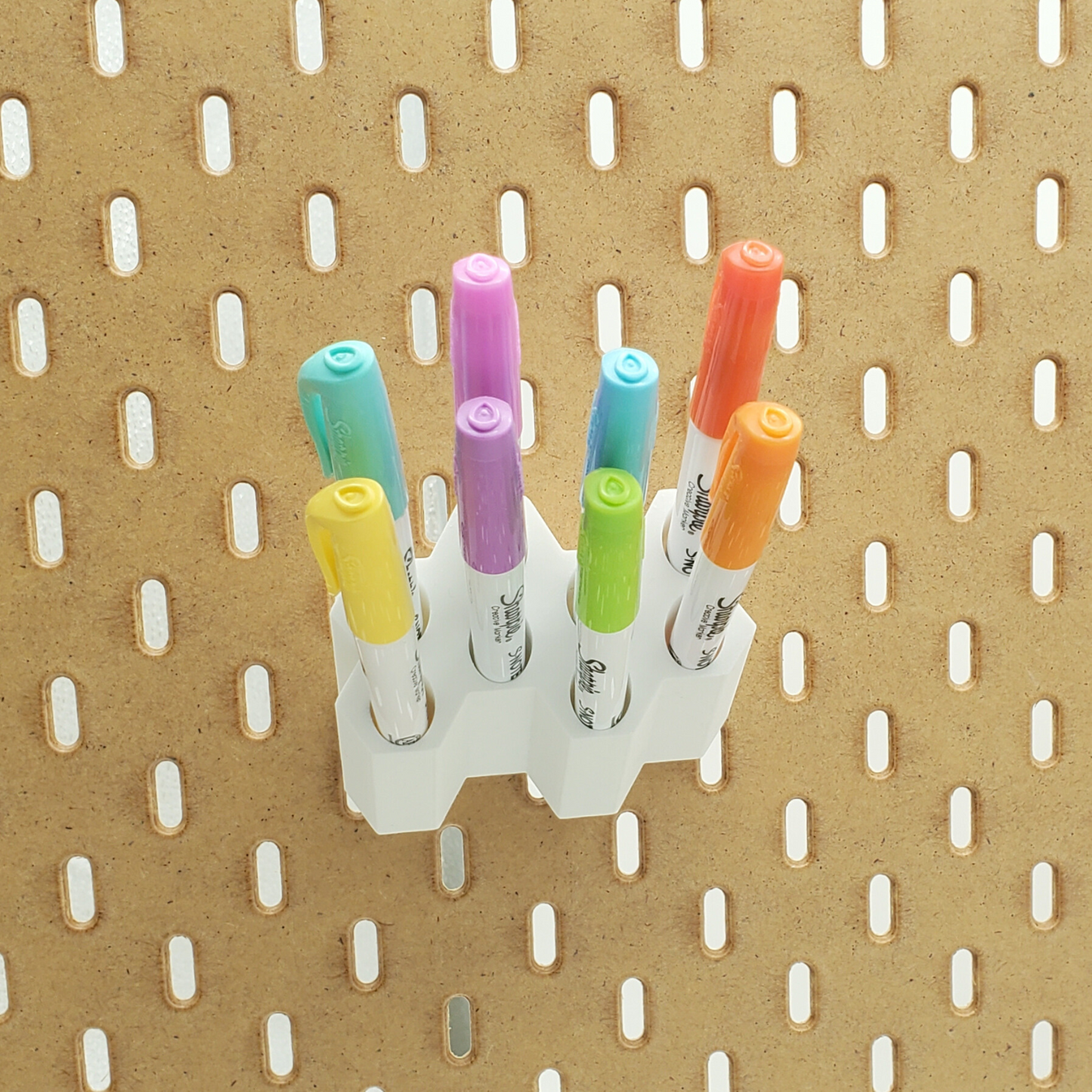 Front view of SKADIS Pegboard marker storage with Sharpie props.