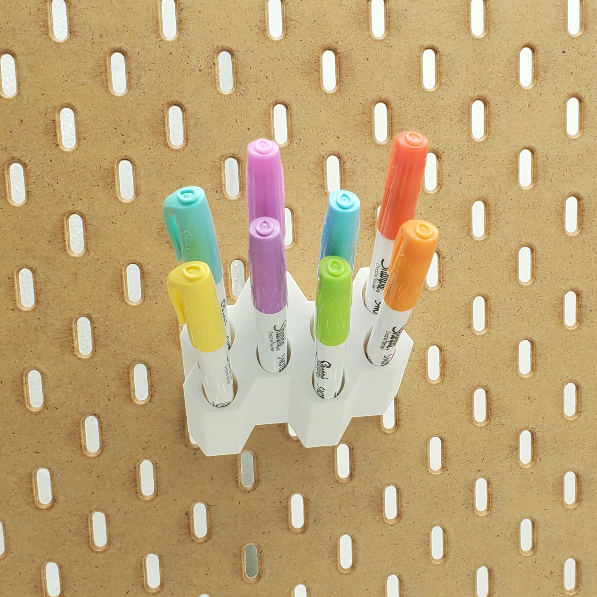 Front view of SKADIS Pegboard marker storage with Sharpie props.