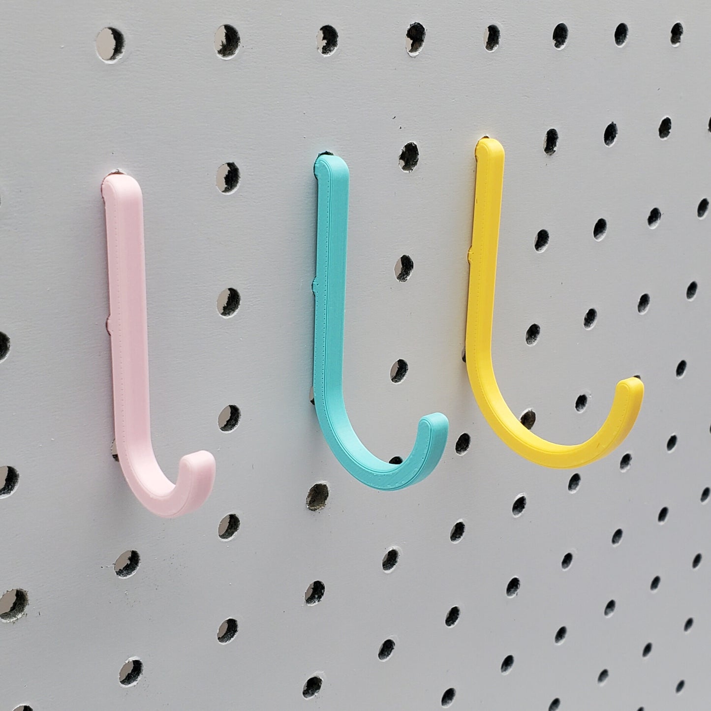 Light Pink, Teal, and Savannah Yellow J-Hooks for 1/4" Pegboards