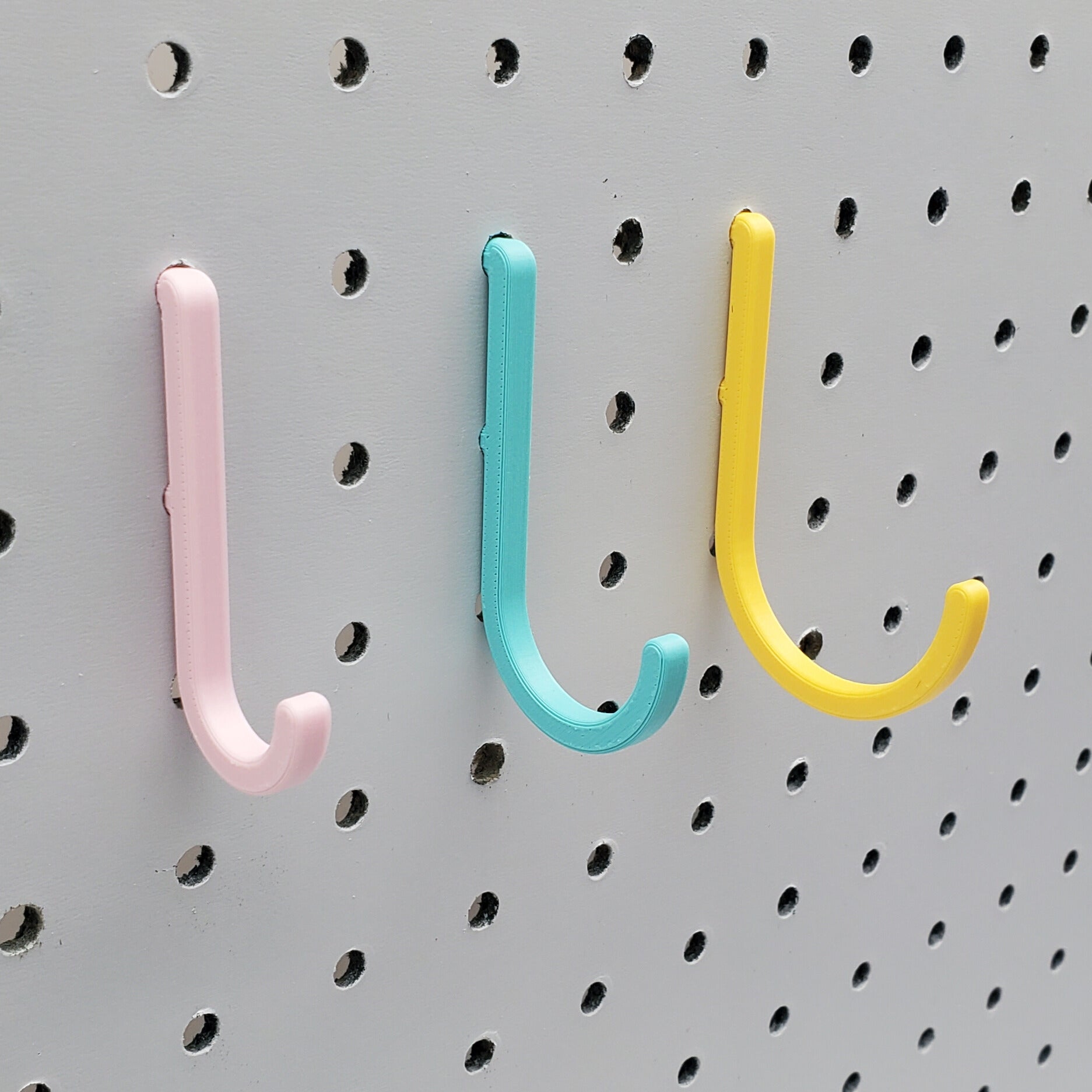 Light Pink, Teal, and Savannah Yellow J-Hooks for 1/4" Pegboards