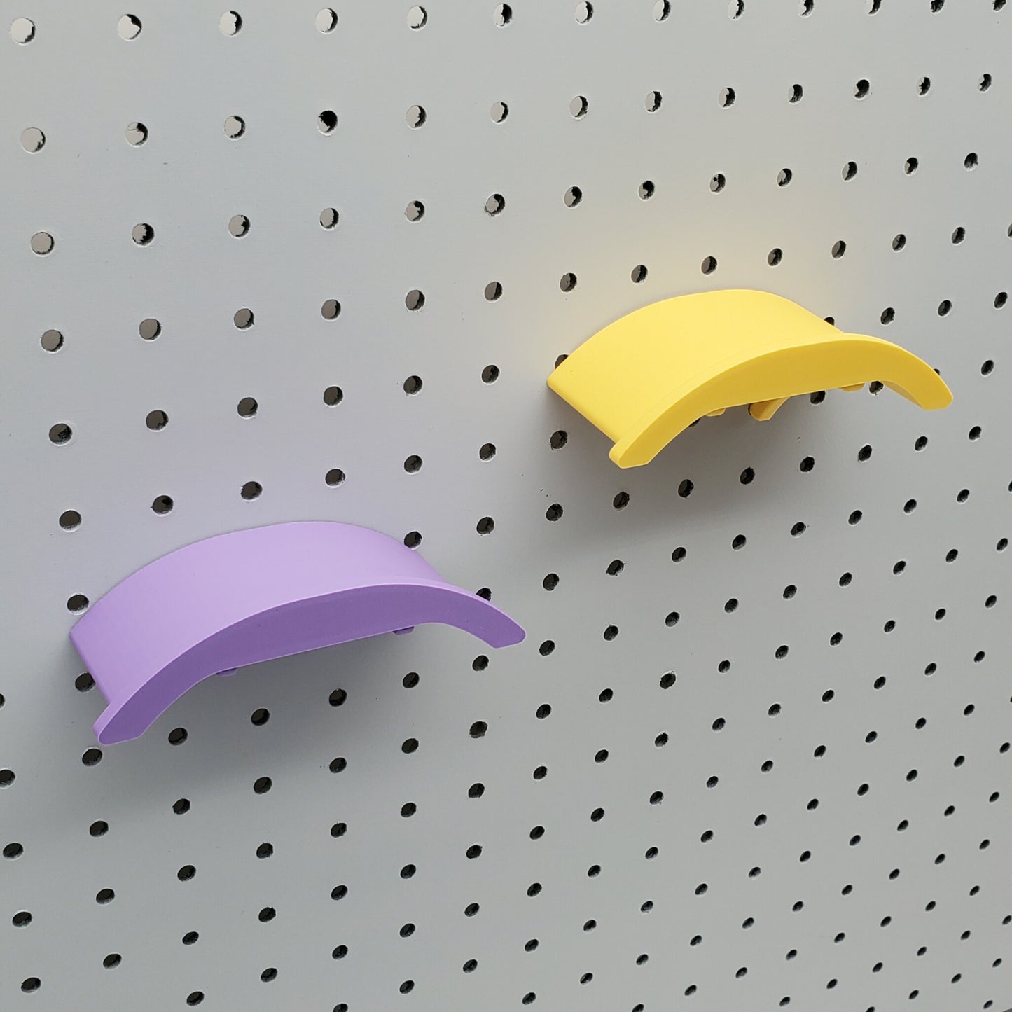 Savannah Yellow  and a Lavender Purple Headphone holder on a 1/4" Pegboard
