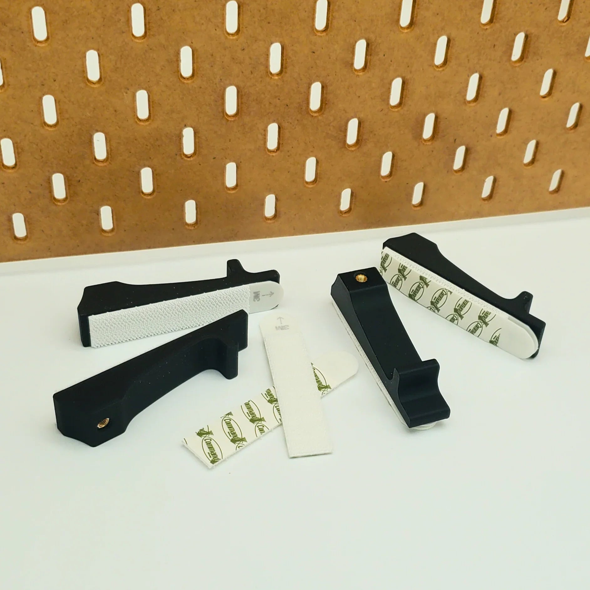 Command Strip Mounting Hardware in Charcoal Black with Command Strips and IKEA SKADIS pegboard.