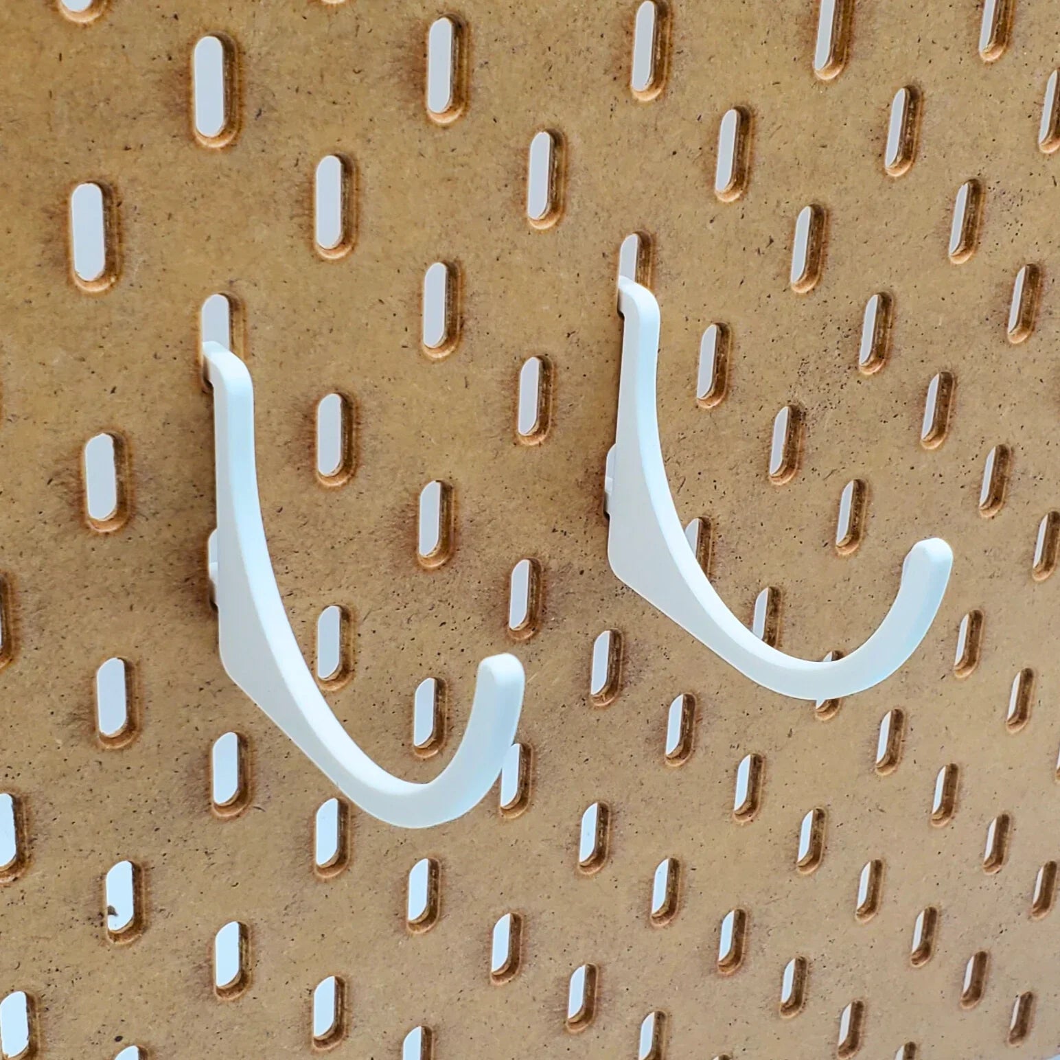 Roll Hooks Set in Cotton White on IKEA SKADIS pegboard.