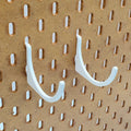 Roll Hooks Set in Cotton White on IKEA SKADIS pegboard.