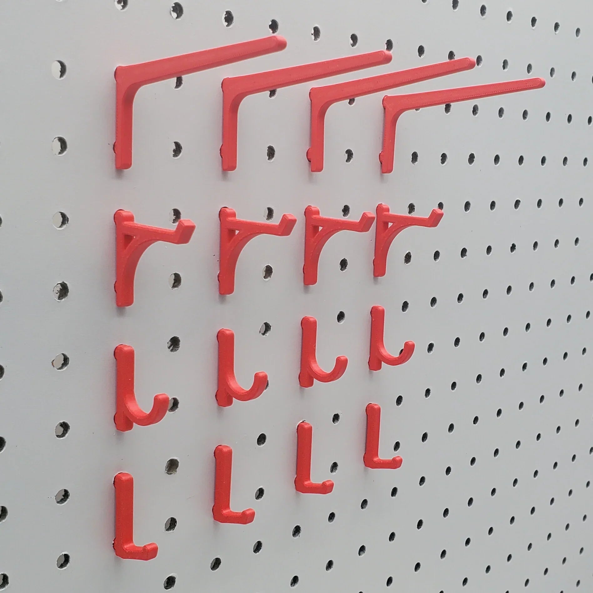 Display Hooks in Light Pink, Teal and Charcoal on IKEA SKADIS pegboard.