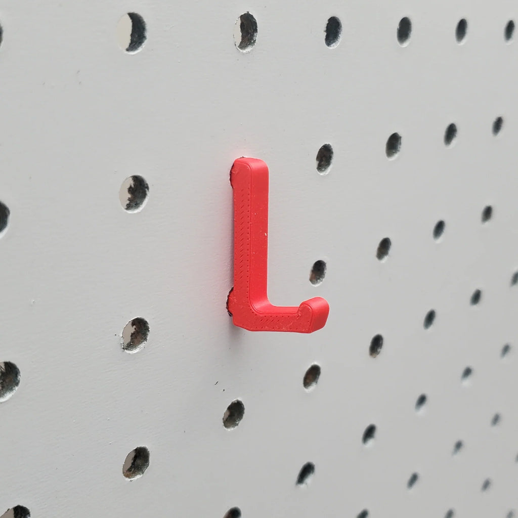 Display Hook in Lava Red on 1/4" Pegboard.