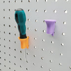 Two Single Screwdriver Holders in Sunrise Orange and Lavender Purple on 1/4" pegboard.
