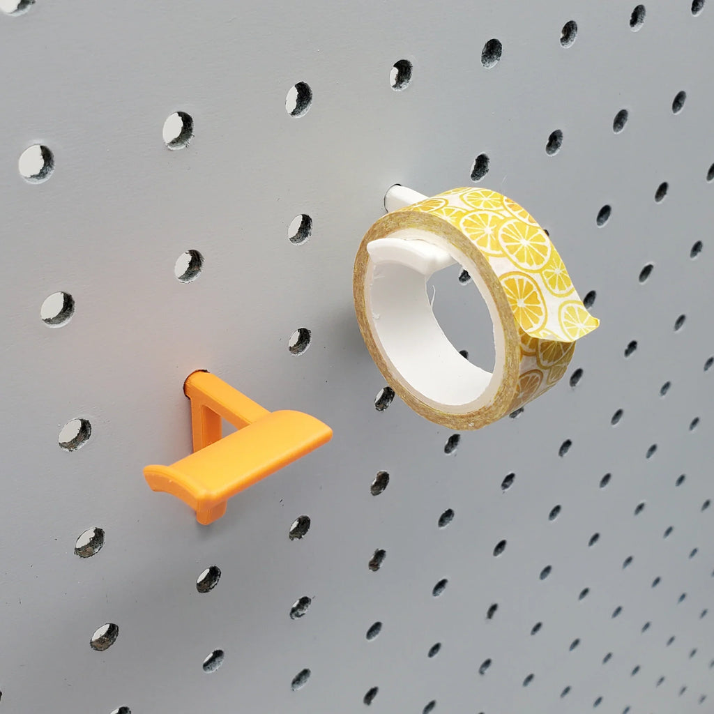 Washi Tape Storage Hooks in Sunrise Orange and Cotton White on 1/4" pegboard with Washi tape.