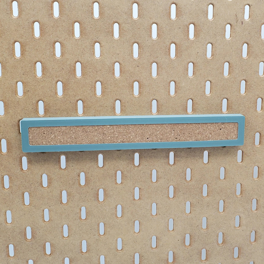 Large Corkboard Strip in Muted Green on IKEA SKADIS pegboard.