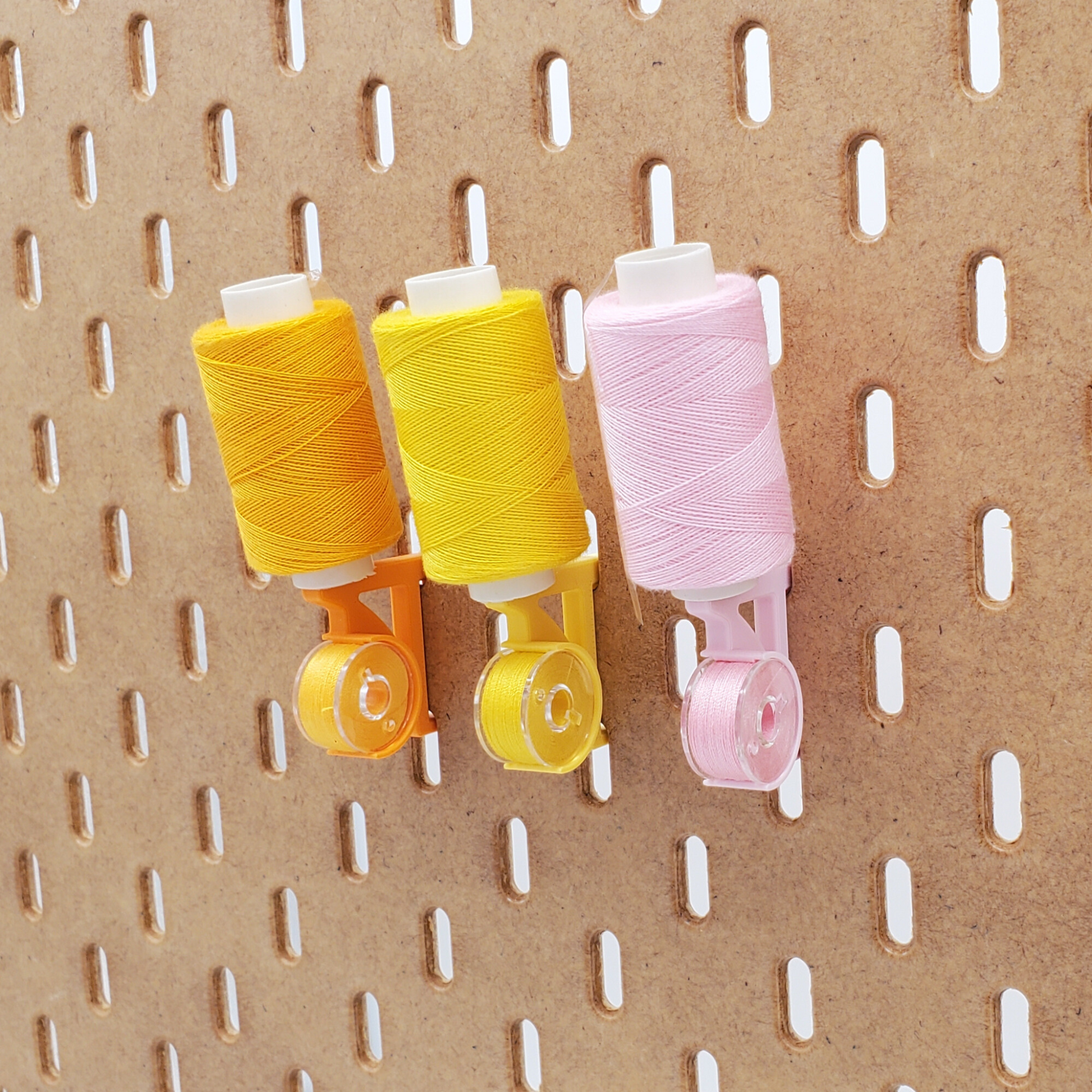 Savannah Yellow, Sunrise Orange, and Light Pink Straight thread/bobbin holders for SKADIS pegboard