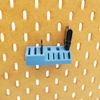 Small Memory Card Holder in Muted Blue on IKEA SKADIS pegboard.
