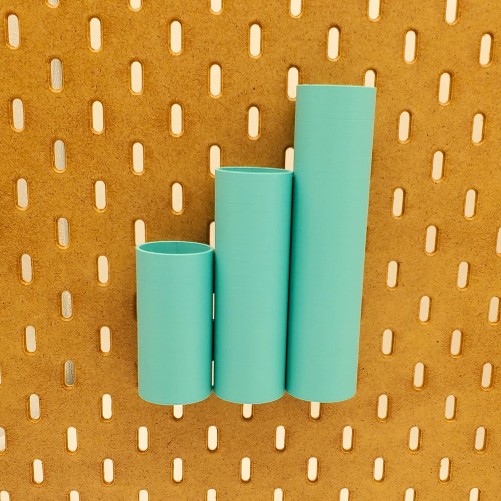 3 Pack of Small, Medium, and Large Cylinder Pen Tubes in Teal on IKEA SKADIS pegboard.