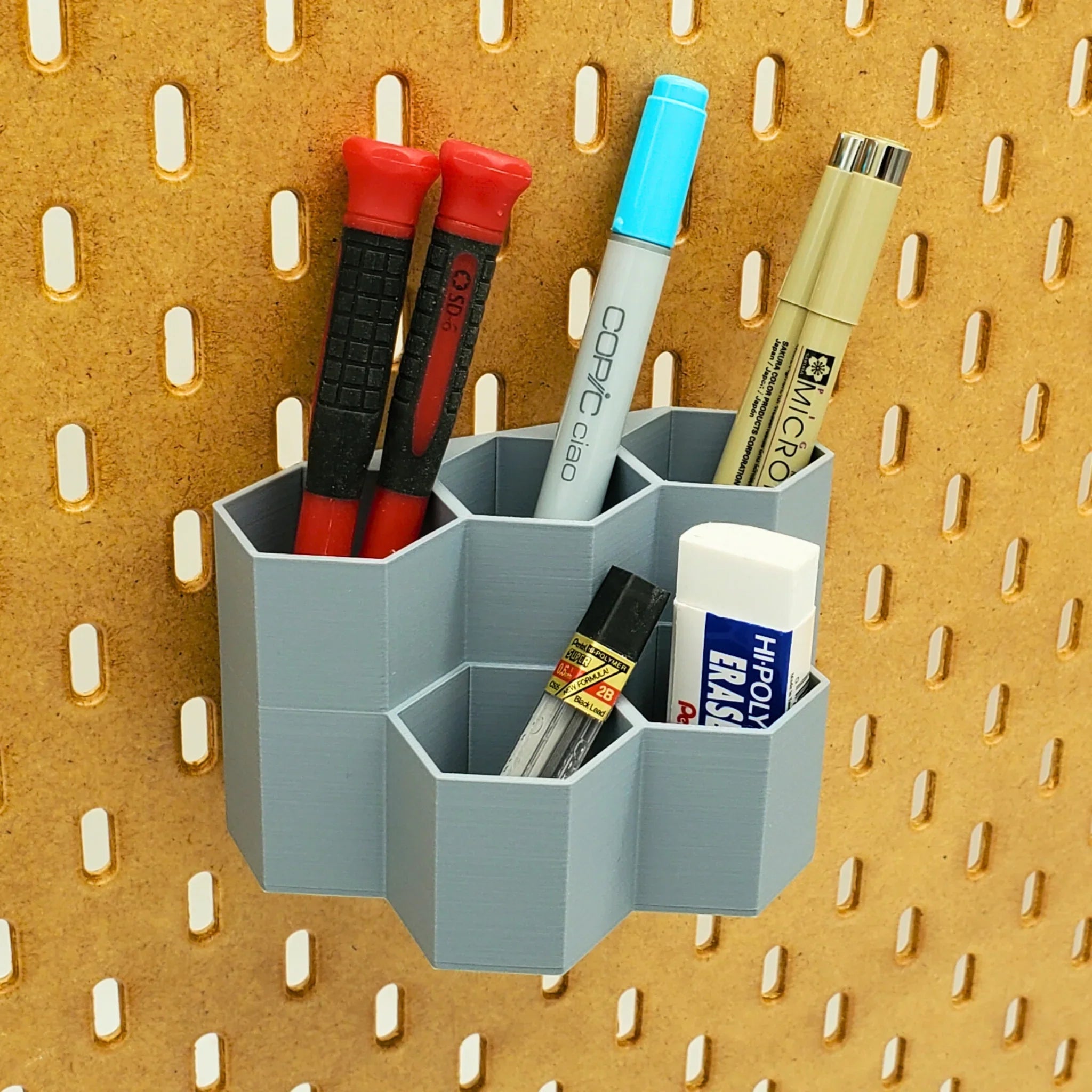 Tall Hexagon Tiered Pen and Pencil Organizer in Fossil Gray on IKEA SKADIS pegboard.