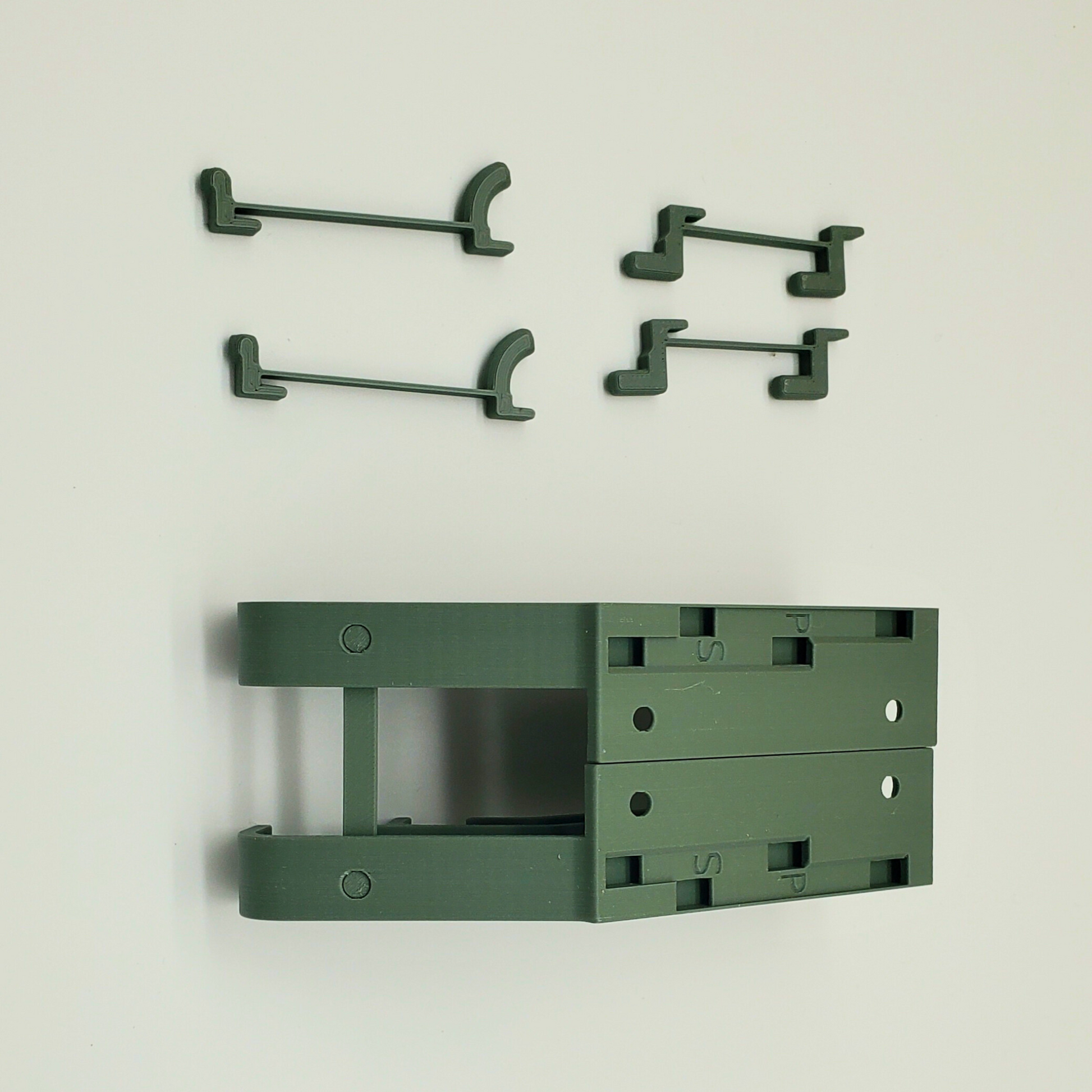 IKEA Skadis Pegboard Muted green battery holder with hooks provided