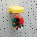 Mason Jar Storage lid in Savannah Yellow on 1/4" pegboard.