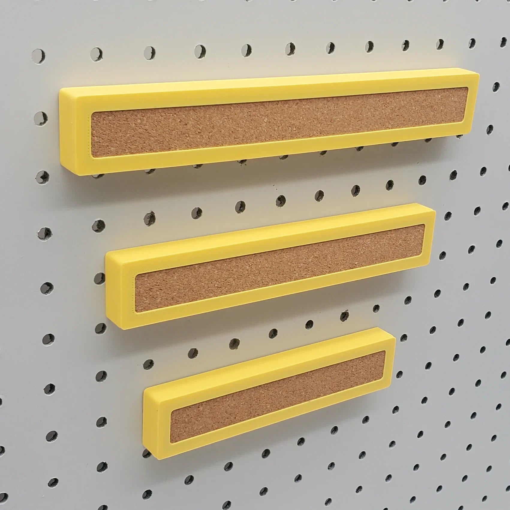 1 Small, 1 Medium, 1 Large Corkboard Strip in Savannah Yellow on 1/4" pegboard.