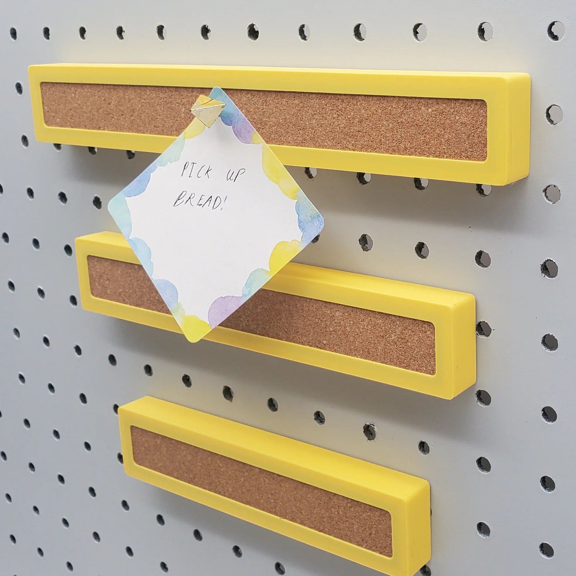 1 Small, 1 Medium, 1 Large Corkboard Strip in Savannah Yellow on 1/4" pegboard.