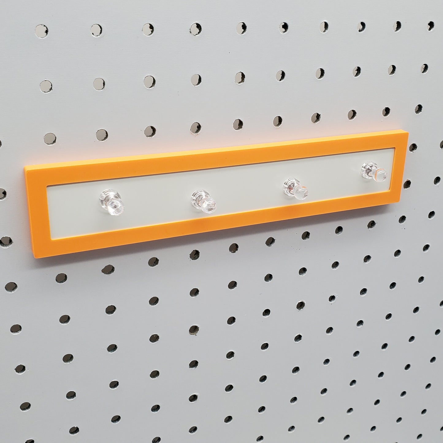 Sunrise Orange Magnet board on a 1/4" Pegboard with Magnets included