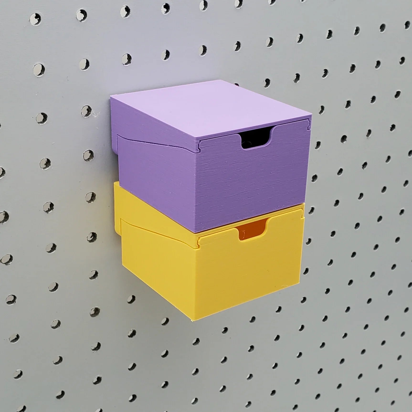Two Small Stackble Drawers in Lavender Purple and Savannah Yellow on 1/4" Pegboard.