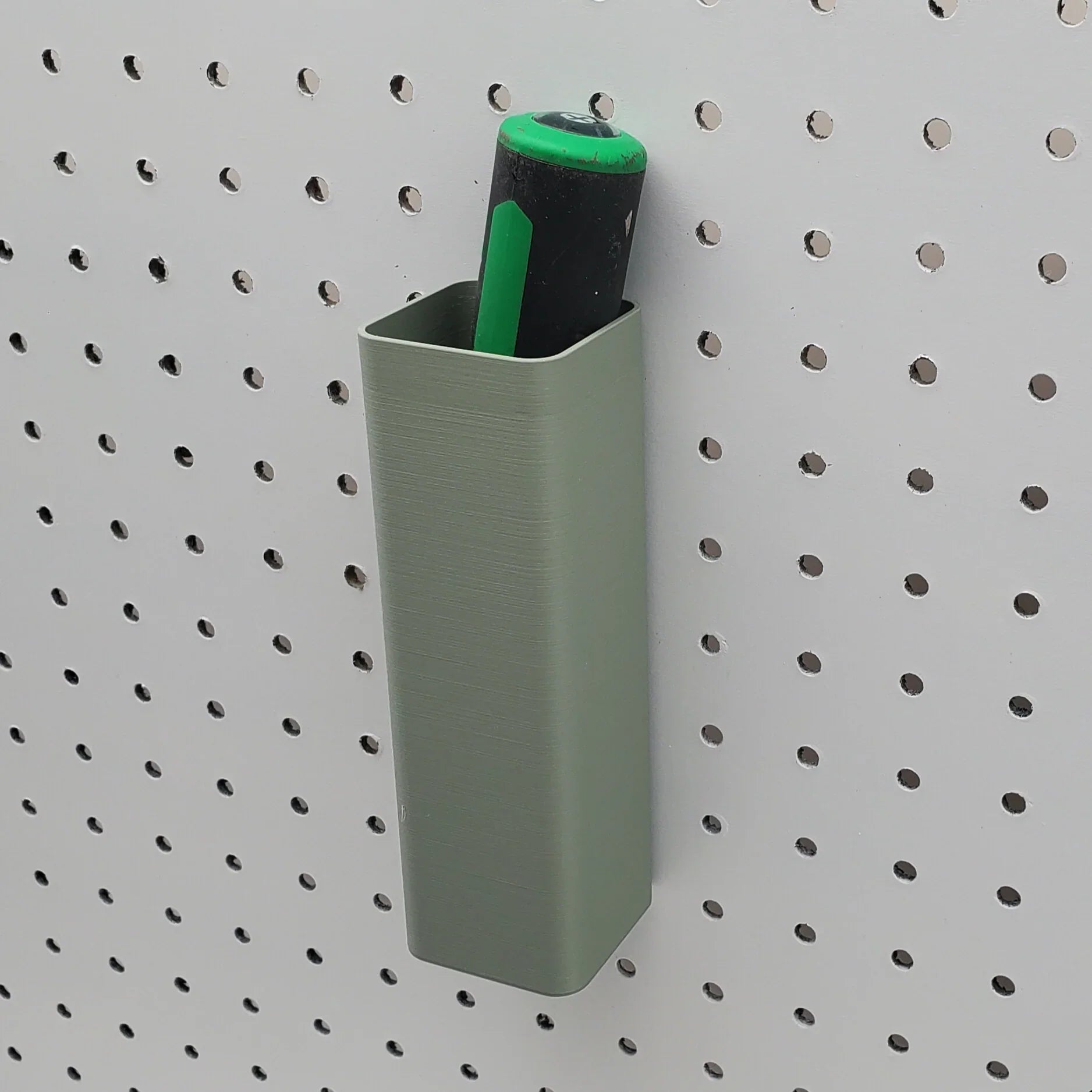 Large Square Bin in Muted Green on 1/4" pegboard with pens.