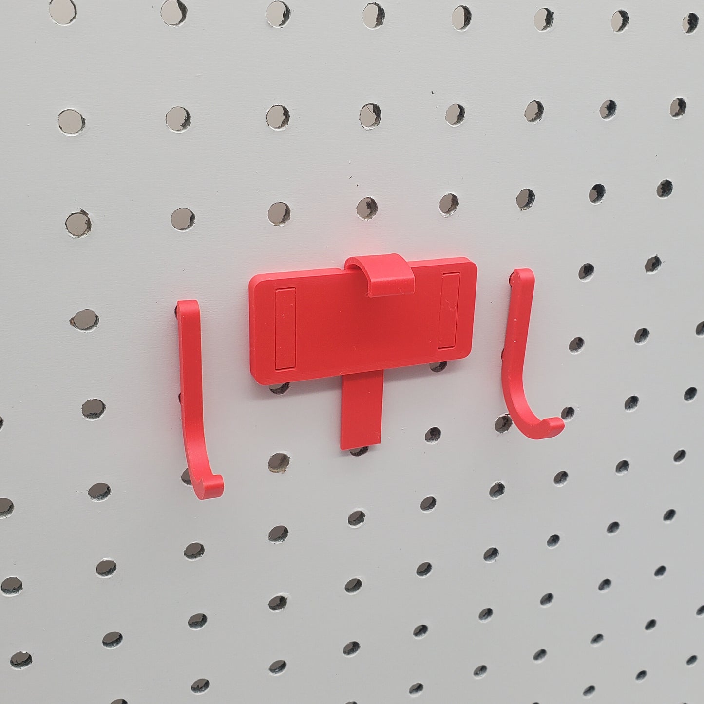 Tablet Holder in red on 1/4" Pegboard