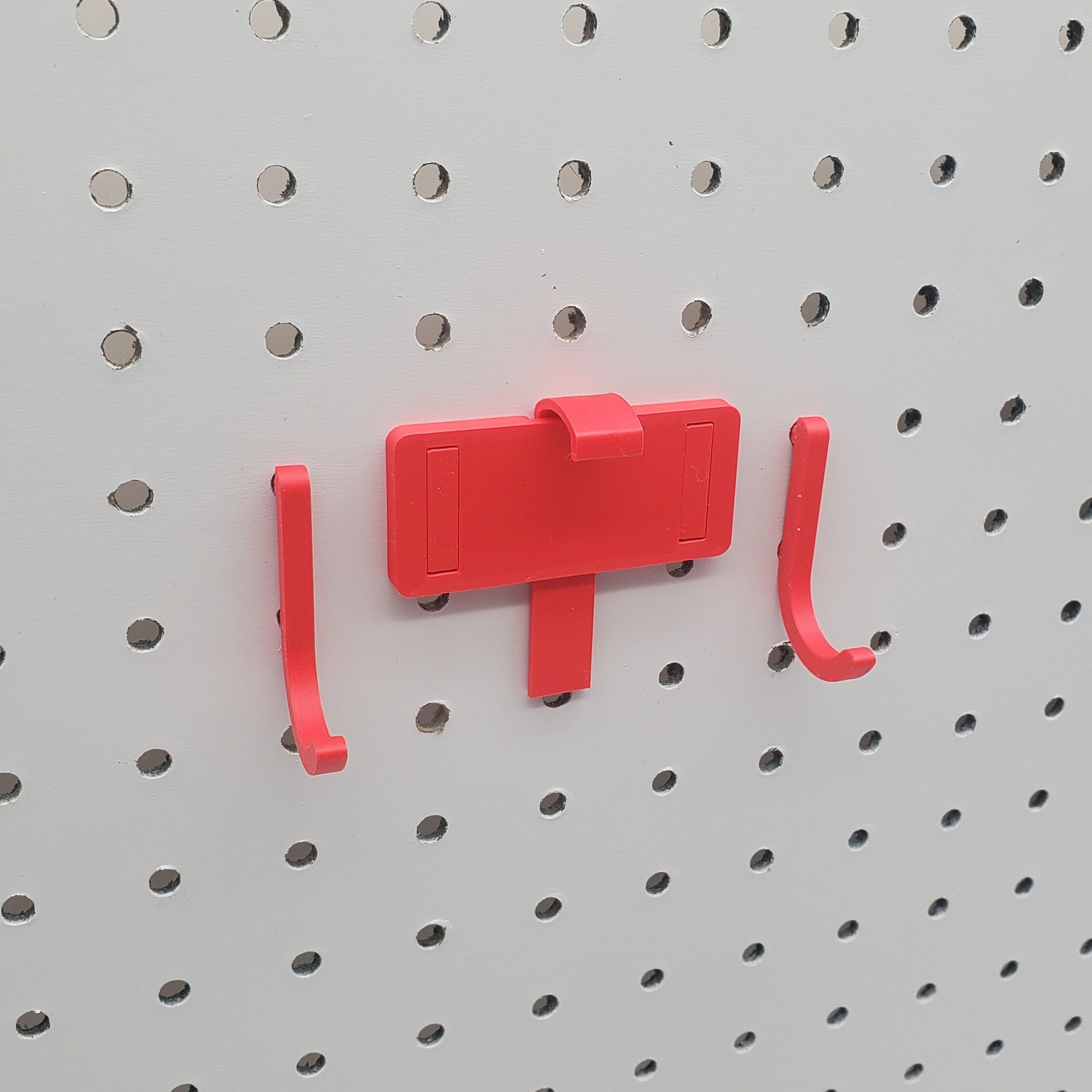 Tablet Holder in red on 1/4" Pegboard