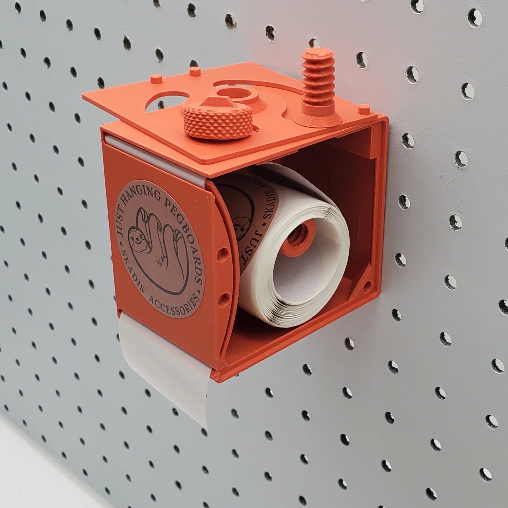 Label Dispenser in Sunrise Orange on 1/4" pegboard.