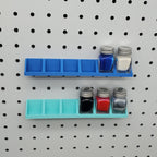 Testors Paint Rack in Sapphire Blue and Teal on 1/4" pegboard with Testors Paint Bottles.