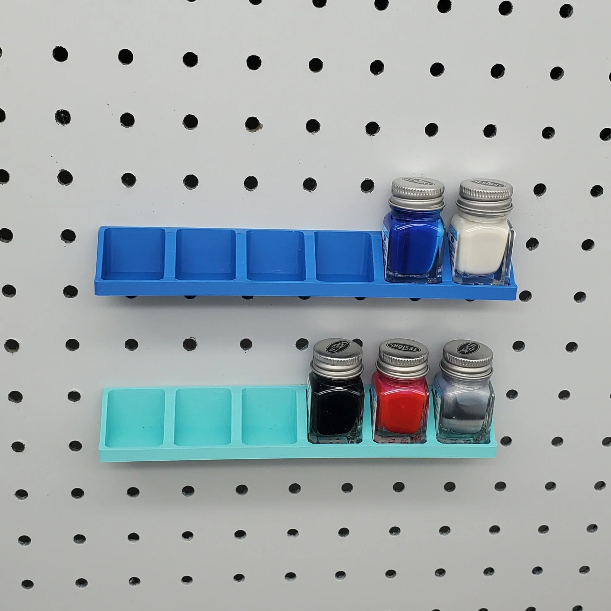 Testors Paint Rack in Sapphire Blue and Teal on 1/4" pegboard with Testors Paint Bottles.