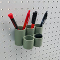 Cylinder Tiered Pen & Pencil Organizer in Muted Green on 1/4" Pegboard with writing utensils.