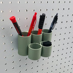 Cylinder Tiered Pen & Pencil Organizer in Muted Green on 1/4" Pegboard with writing utensils.