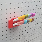 Sharpie Organizer with colorful Sharpies in Lava Red on 1/4" pegboard.