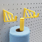 Detail of Paper Towel Holder in Savannah Yellow on 1/4" pegboard with blue shop towels.