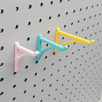 Small, Medium, and Large Platform Hooks in Light Pink, Teal, and Savannah Yellow on 1/4" pegboard.