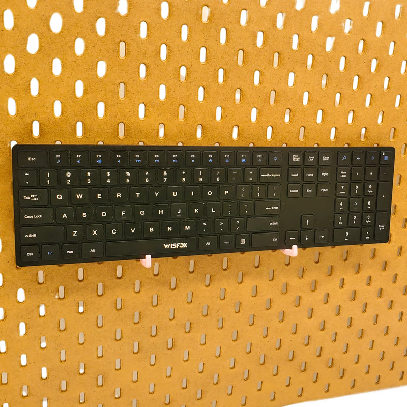 Keyboard Hooks in Light Pink on IKEA SKADIS pegboard.
