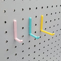 L Hooks in Light Pink, Teal and Savannah Yellow, small, medium, and large on 1/4" pegboard.
