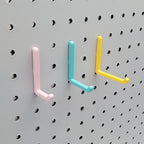 L Hooks in Light Pink, Teal and Savannah Yellow, small, medium, and large on 1/4" pegboard.