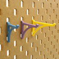 Small, Medium, Large Platform Hooks in Muted Blue, Muted Purple, and Savannah Yellow on IKEA SKADIS Pegboard.