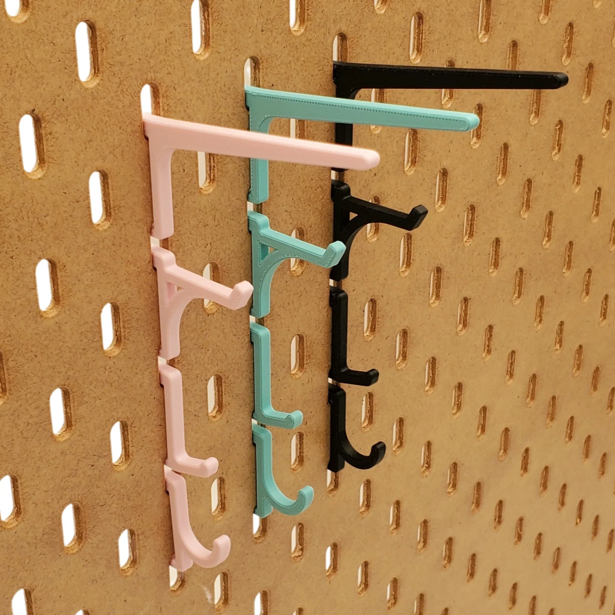 Hook Variety Pack in Lava Red on 1/4" pegboard.