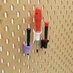Three Single Screwdriver Holders in Lavender Purple, Cotton White, and Charcoal Black on IKEA SKADIS pegboard.