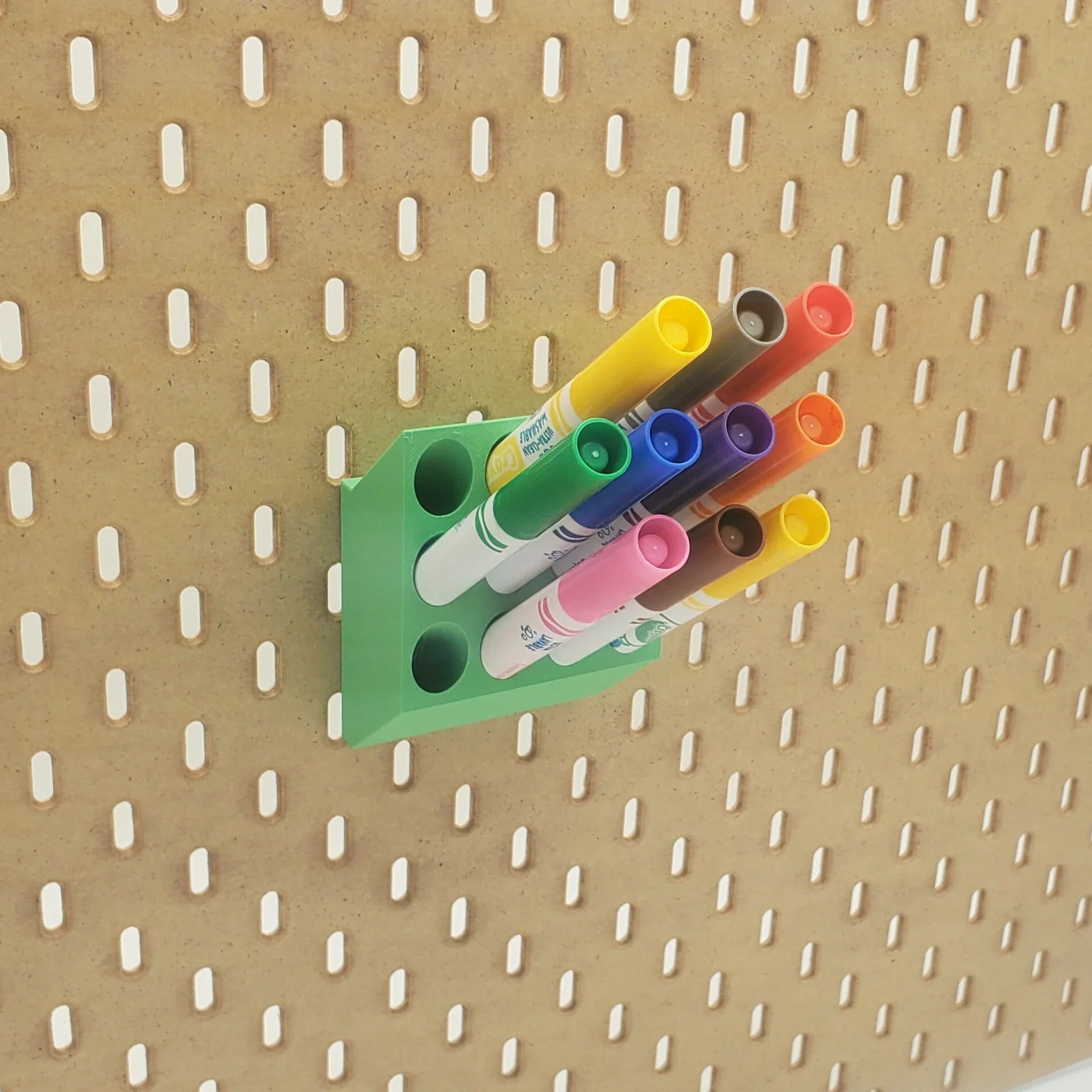 Crayola Marker Organizer with colorful markers on IKEA SKADIS pegboard.