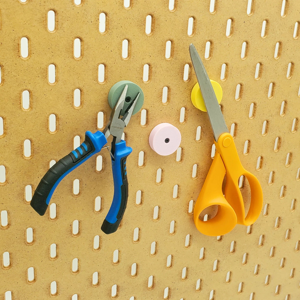 Three Large Magnetic Tool Holders in Muted Greed, Light Pink, and Savannah Yellow on IKEA SKADIS pegboard, holding scissors and pliers.