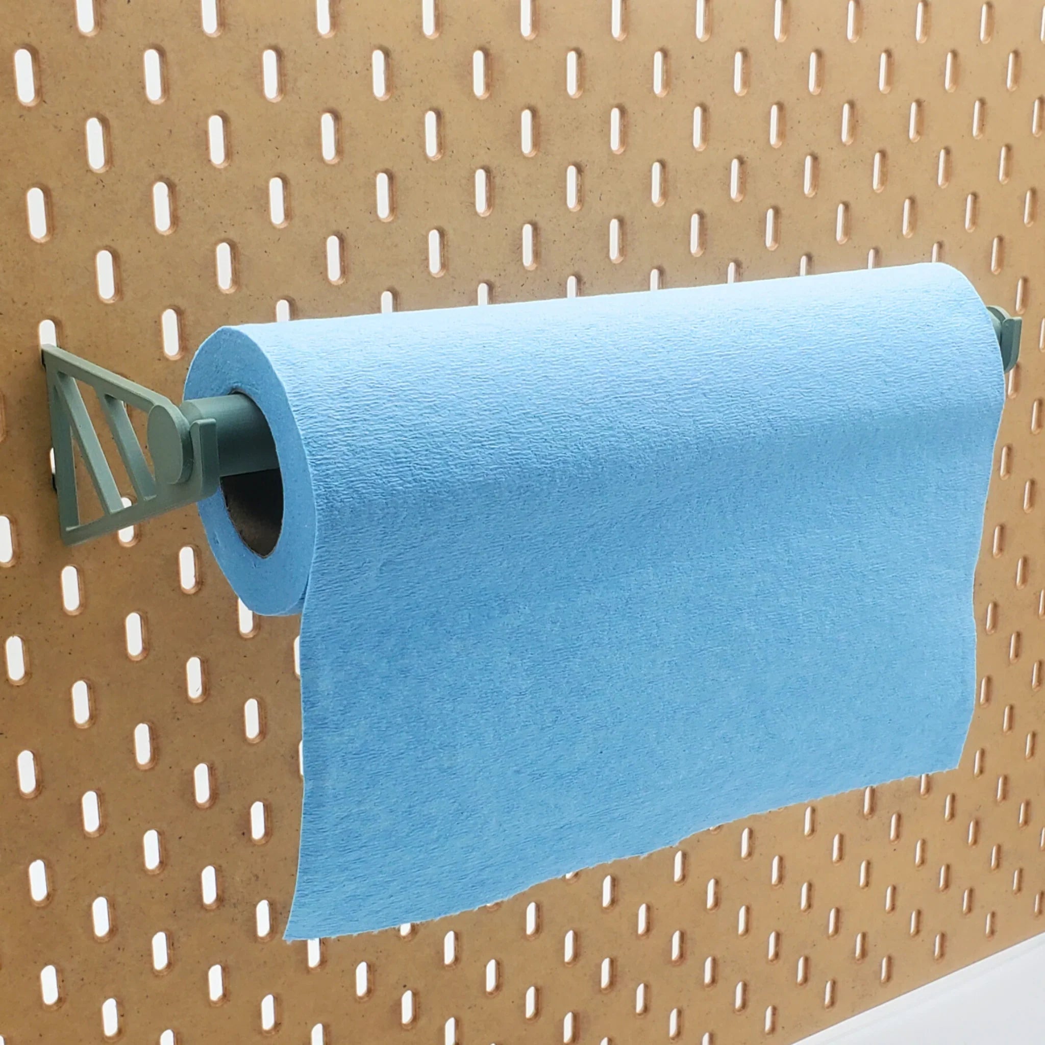 Paper Towel Holder in Muted Green on IKEA SKADIS pegboard with blue shop towels.